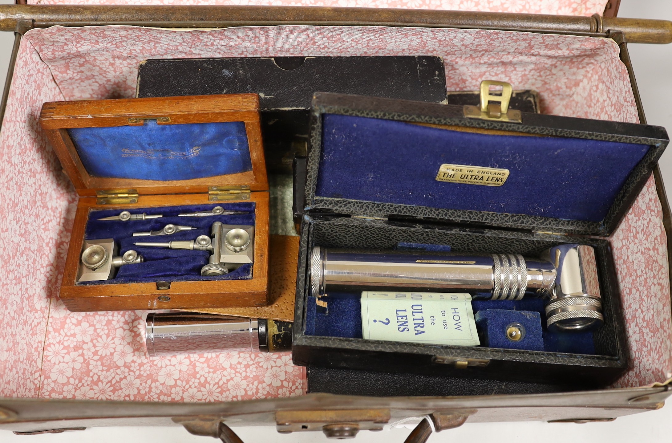 A small suitcase of draughtsman’s, scientific and medical instruments and a champagne tap